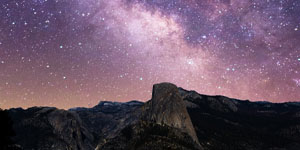 purple galaxy over mountain