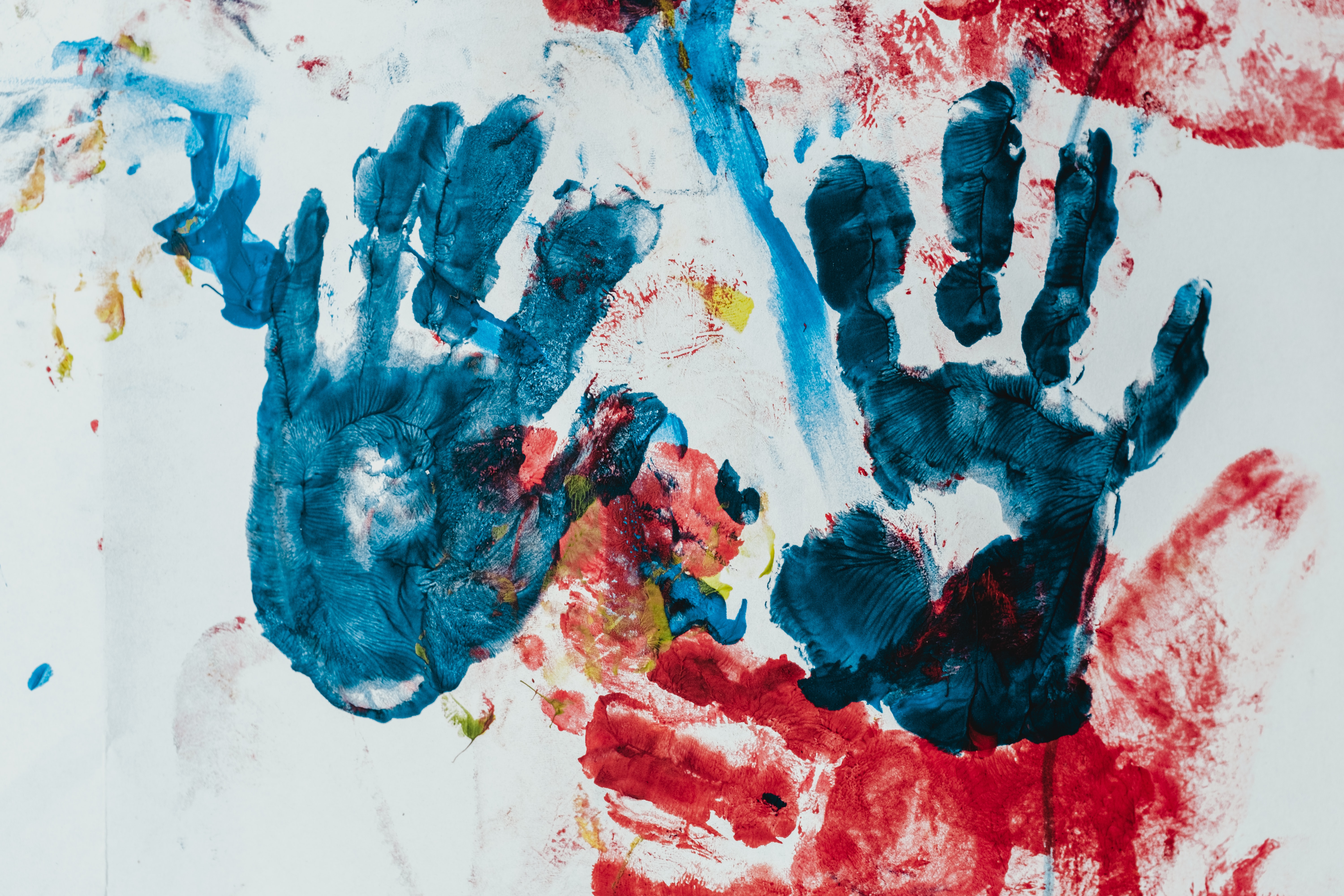 blue fingerpainting hands